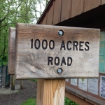 1000 Acres Road Trail sign